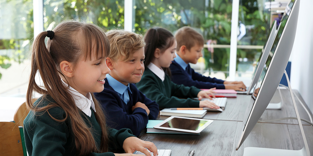 School children using computers in class