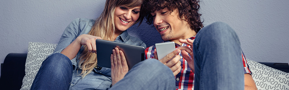 Young couple browsing the internet on a tablet