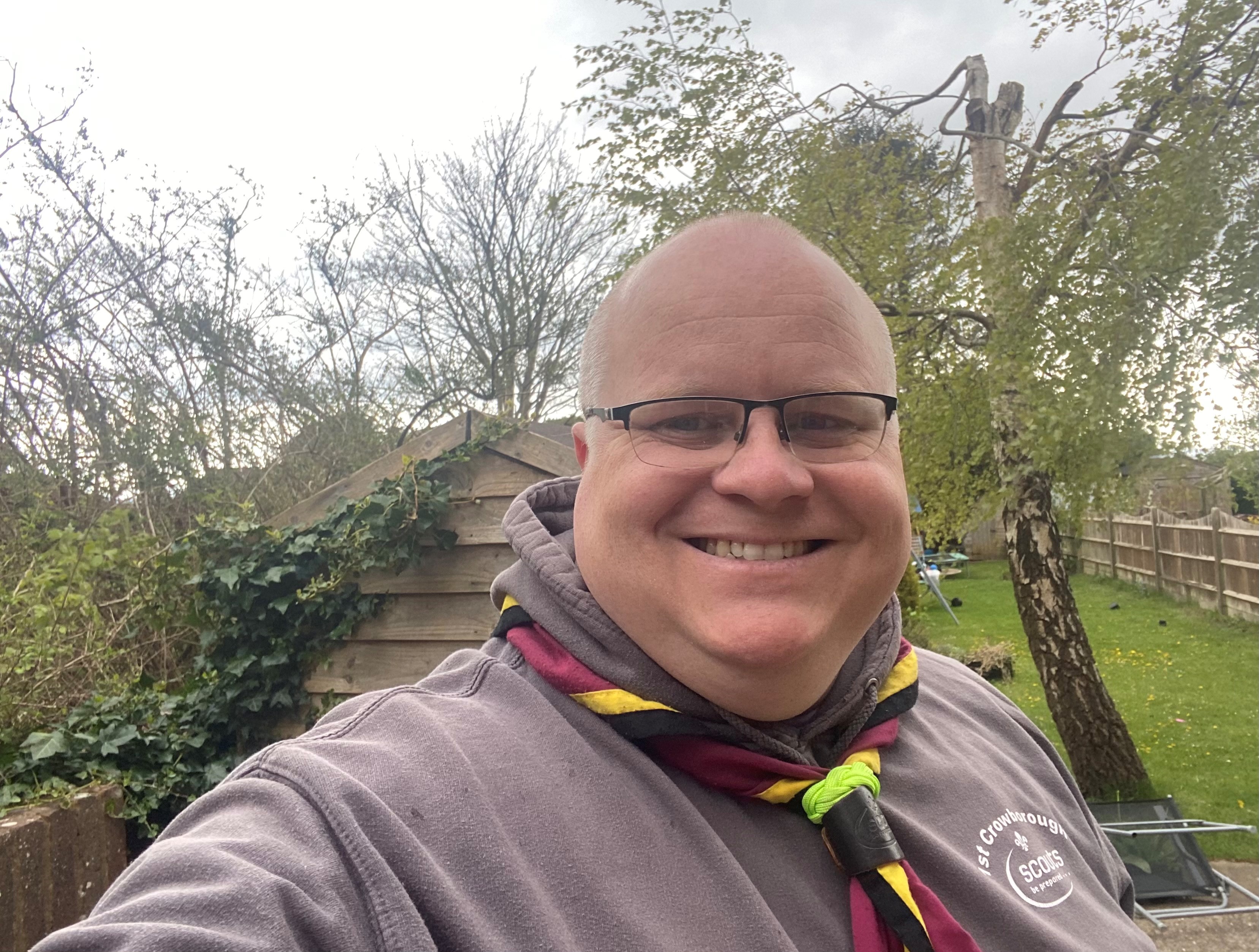 Image showing a scout leader smiling at a camera