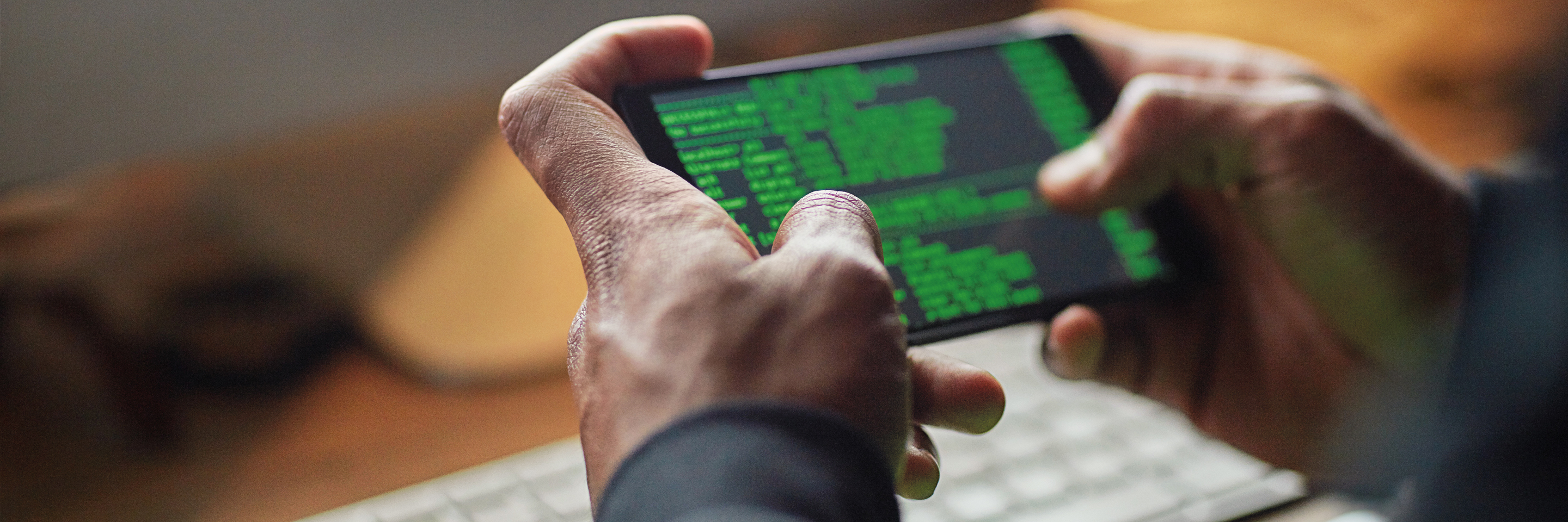 Person coding on phone