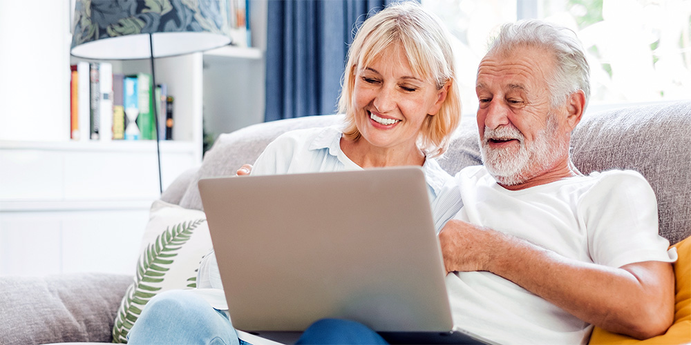 Older couple using a laptop
