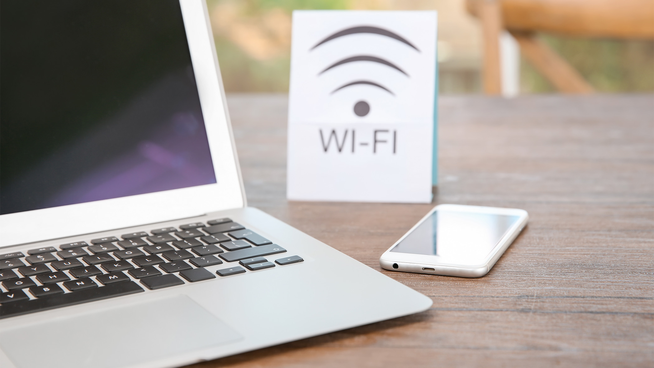 Devices next to a public wifi sign
