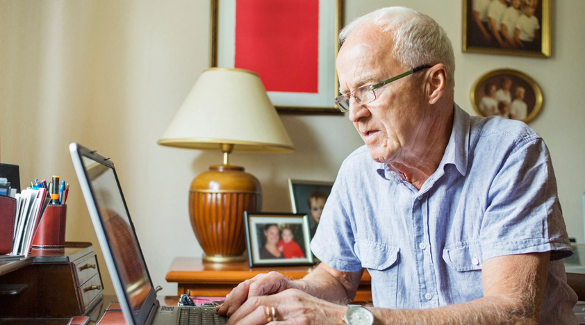 Elderly Man Using Laptop