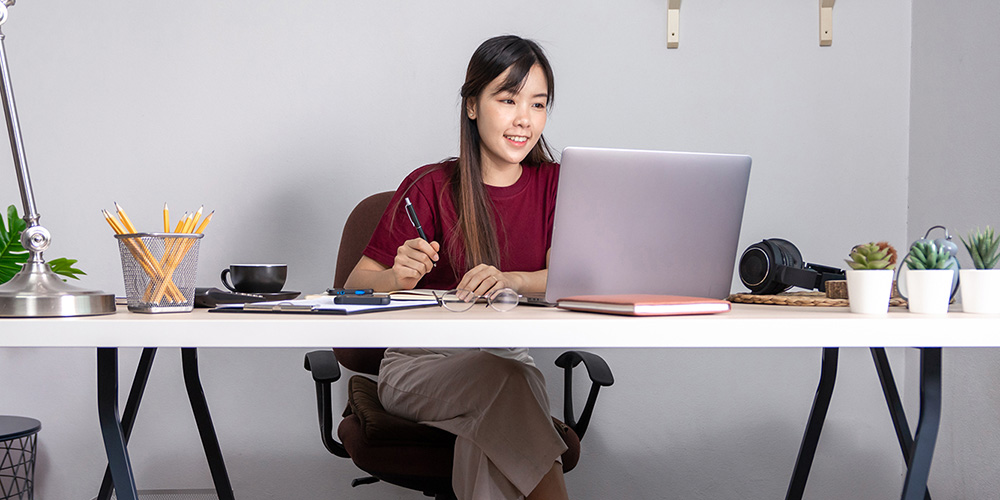 Home worker working on her laptop in home office