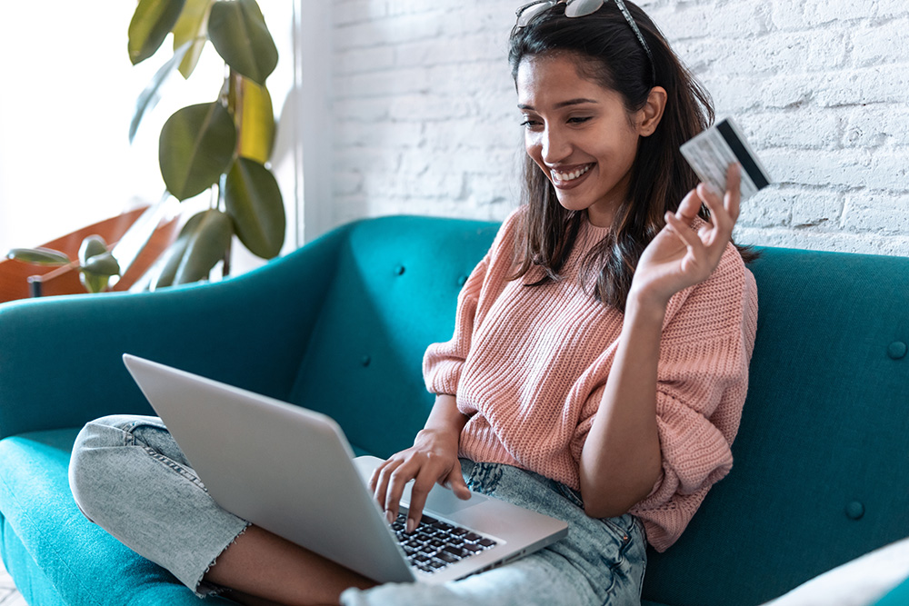 Lady smiling while making a purchase online