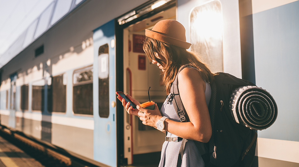 Lady looking at her phone on her travels