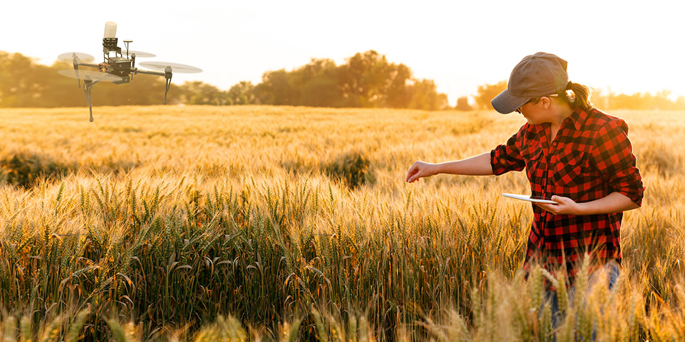 Farmer using a drone to cultivate crops