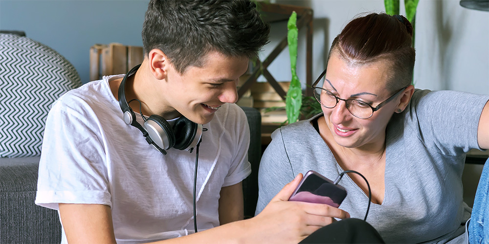 Son sharing music with his mum