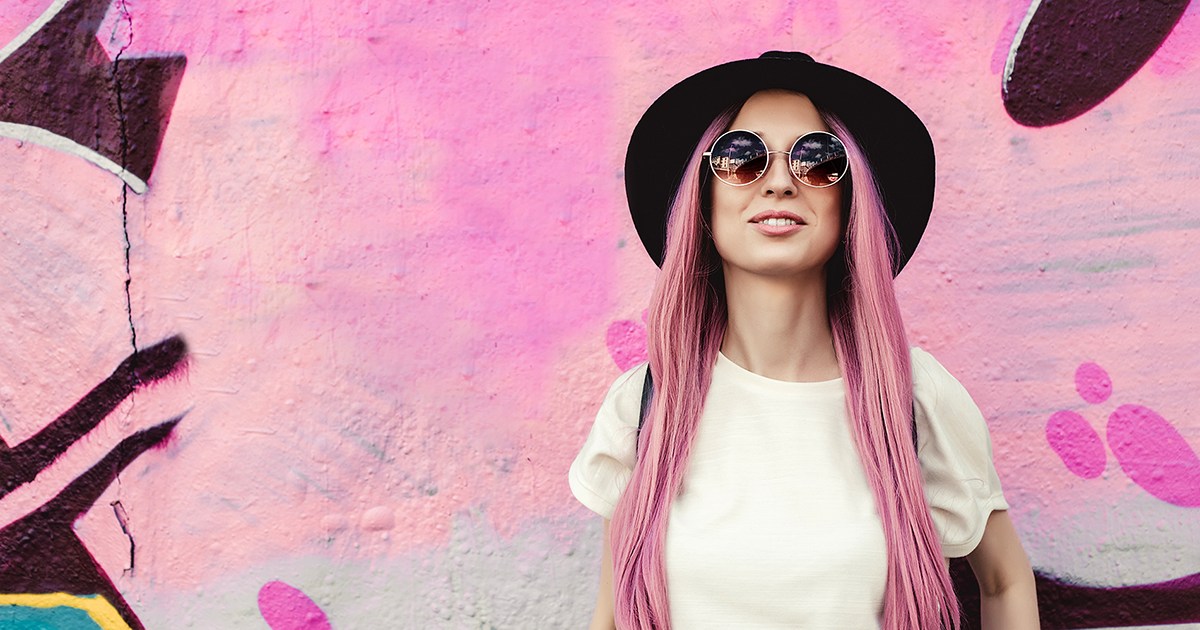 Pink haired woman against pink patterned background - Smartphone Photography Course