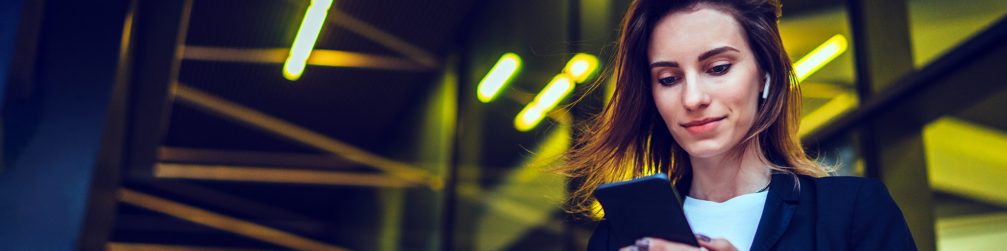 Lady looking at her smart phone | Keep Safe Online | Digital Wings